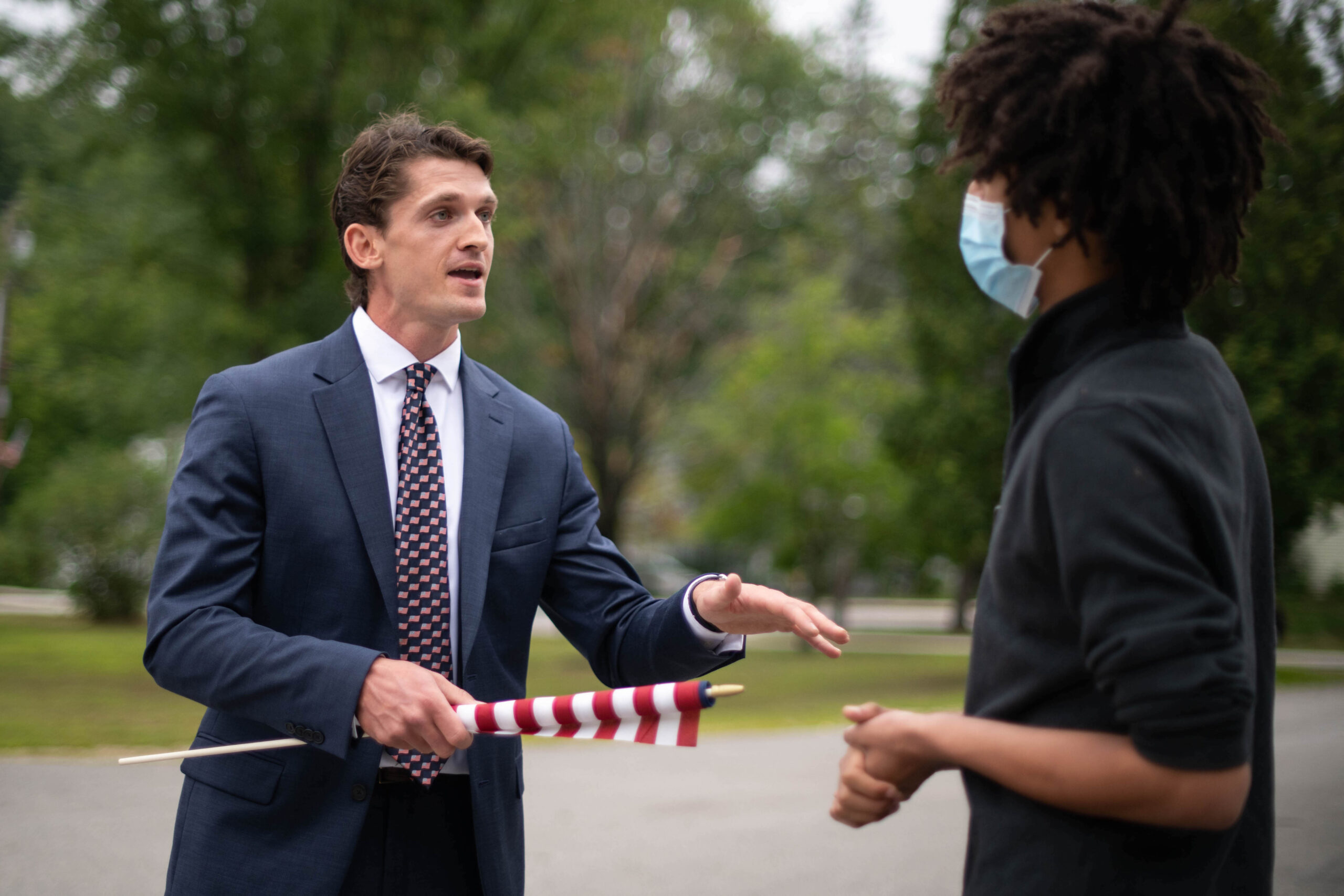 Greg Carter, left, tells Jonah Wheeler, right, both of Peterborough, New Hampshire, that systemic racism doesn't exist during a "Pro-Police, Pro-America" rally in Peterborough in August, 2020. Photo by Ben Conant/Monadnock Ledger-Transcript